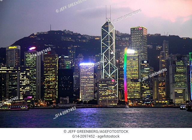 China, Hong Kong, Kowloon, Tsim Sha Tsui, Kowloon Public Pier, view, Victoria Harbour, harbor, Island, city skyline, high rise skyscrapers, buildings, dusk
