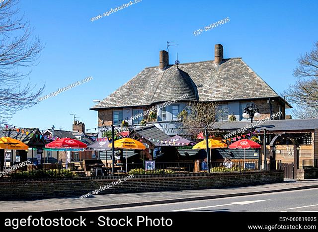 EAST GRINSTEAD, WEST SUSSEX, UK - APRIL 17 : The Railway public house re-opens during the Covid 19 pandemic in East Grinstead on April 17, 2021