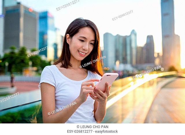 Woman texting on cellphone