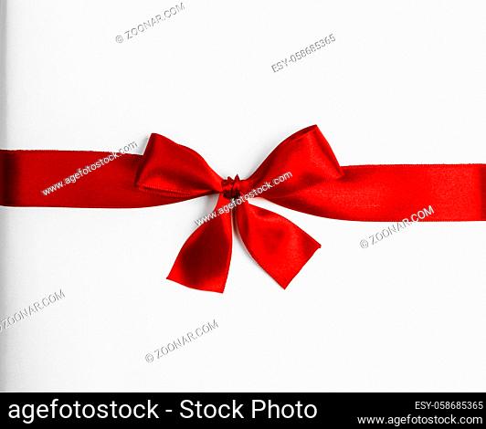 Elegant satin red ribbon bow isolated on white background
