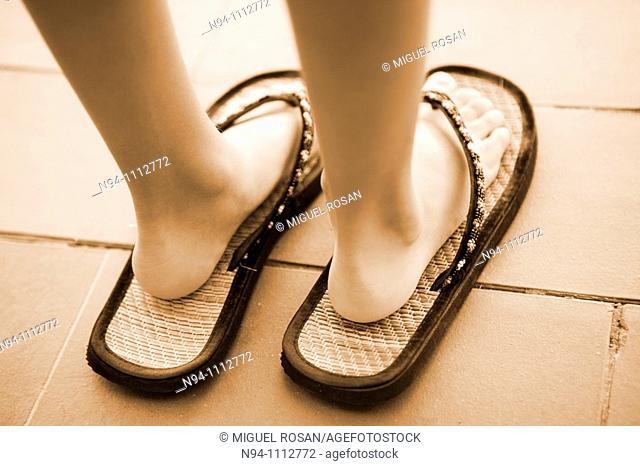 Feet of a girl with shoes adult
