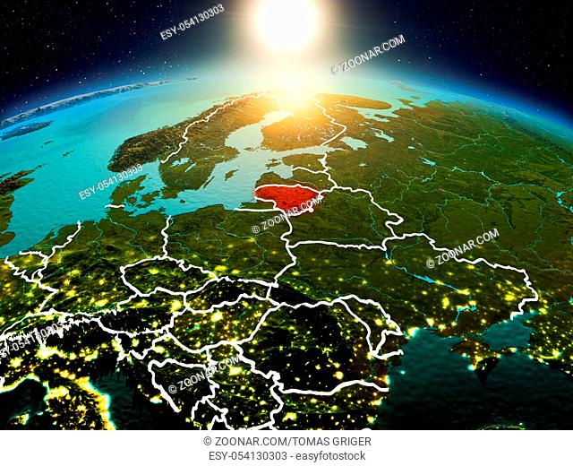 Sunrise above Lithuania highlighted in red on model of planet Earth in space with visible country borders. 3D illustration