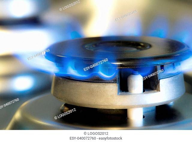 Gas stove with flames of burning gas, studio shot