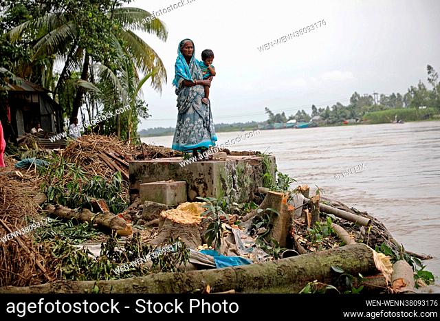 The residents that established on the shore of the Munshiganj river are seen moving to other areas on August 23rd 2021 in Dhaka, Bangladesh