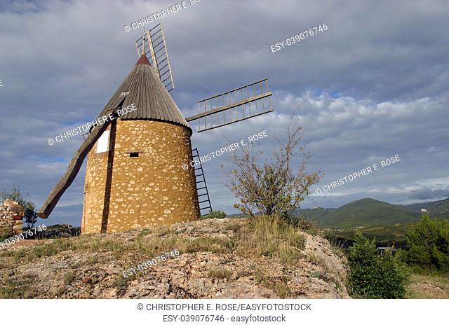 The restored windmill on the hill above St Chinian, Languedoc-Roussillon, France, Europe