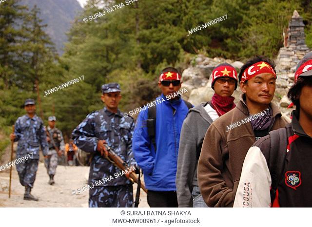 YCL cadres as well as police arrives at a village to provide security for a top level Maoist leader scheduled to visit there April 26, 2007