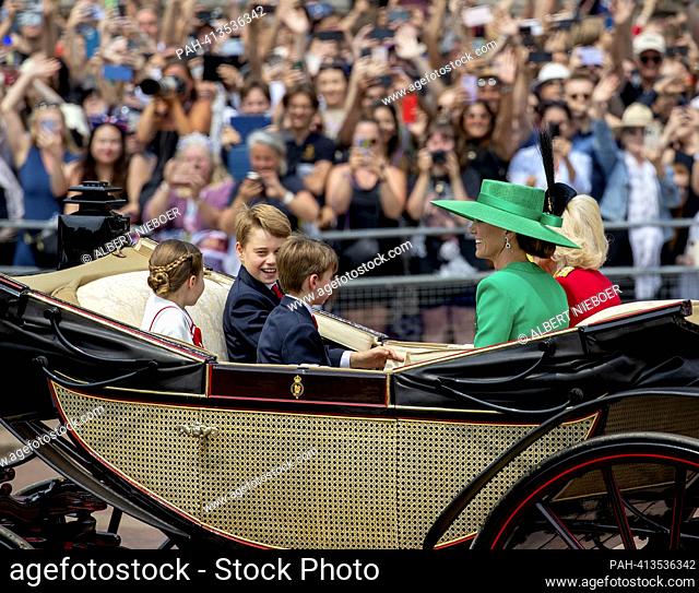 Queen Camilla, Catherine, Princess of Wales, Prince George of Wales and Princess Charlotte of Wales and Prince Louis of Wales return to Buckingham Palace in...