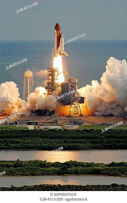 As seen from the roof of the 525-foot Vehicle Assembly Building three miles away, Discovery lifts off on mission STS-120