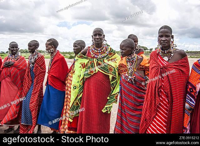 Masai women pose for group picture. Masai Village, Amboseli National Park, Kenya, Africa