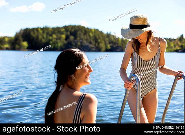 Smiling women on jetty