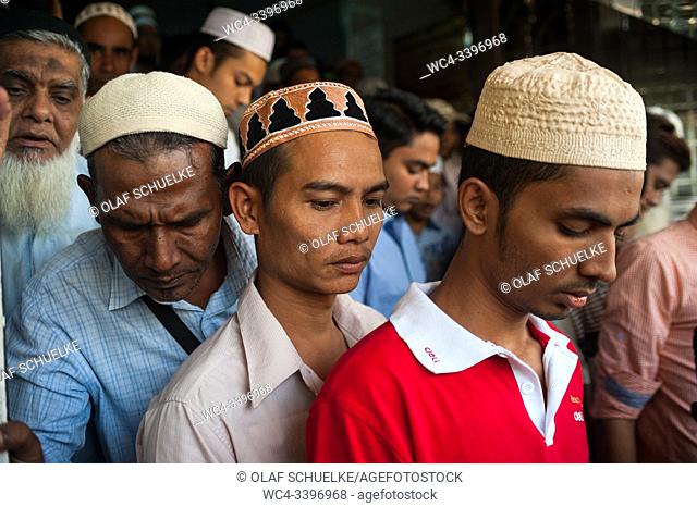 Yangon, Myanmar, Asia - Muslim men leave the Bengali Sunni Jameh Mosque after Friday prayer. Muslims in Myanmar remain a minority but are also a visible part of...