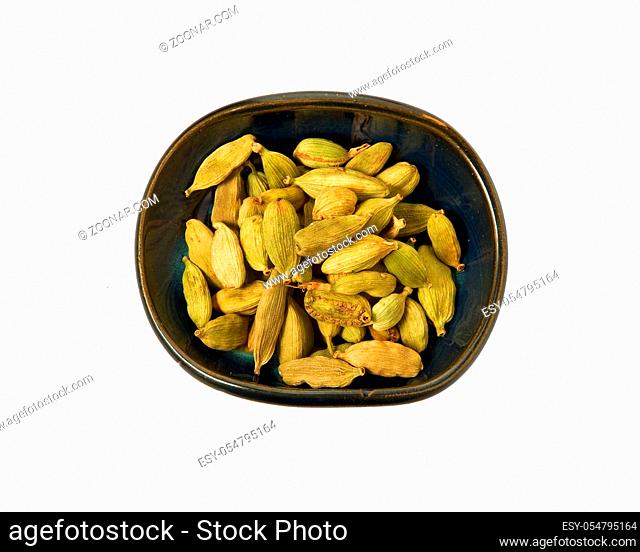 Dry fennel seeds in a bowl isolated on a white background. Seasoning on isolate. View from above. Close up view of fennel