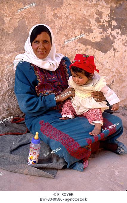 bedouin with little child in the lap, Jordan, Petra