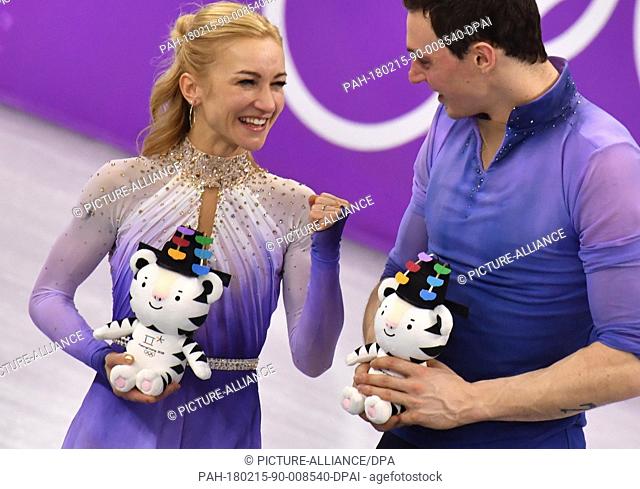Winners Aljona Savchenko and Bruno Massot from Germany standing on the podium during the award ceremony of the figure skating free skate event of the 2018...