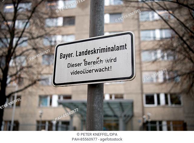 A sign reading 'Bayer. Landeskriminalamt - Dieser Bereich wird videoüberwacht!' (lit. 'Bavarian State Office of Criminal Investigation - This area is being...