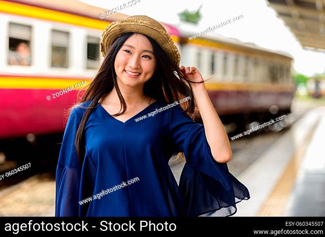 Portrait of young beautiful Asian tourist woman at Hua Lamphong railway station in Bangkok
