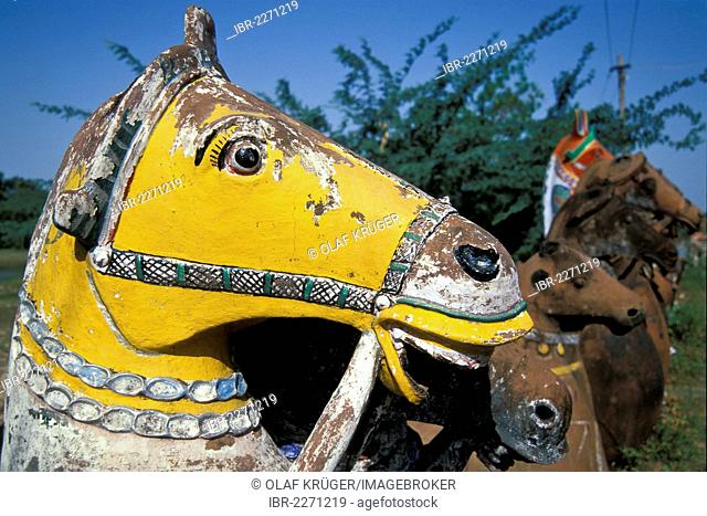 Horse made out of clay, painted yellow, near Karaikudi, Tamil Nadu, South India, India, Asia