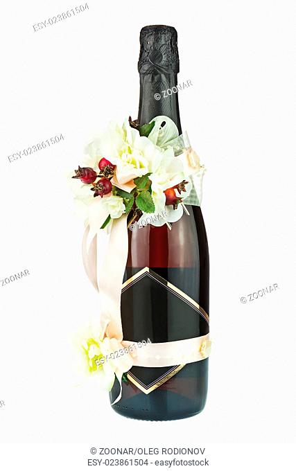 Champagne Bottle with Wedding Decoration of Flower Arrangements Isolated