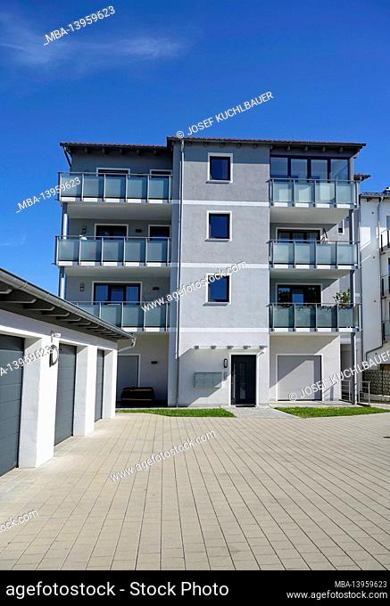 Germany, Bavaria, Upper Bavaria, Altötting district, residential complex, balconies with frosted glass panes, garages, flat roof, entrance area, pavement
