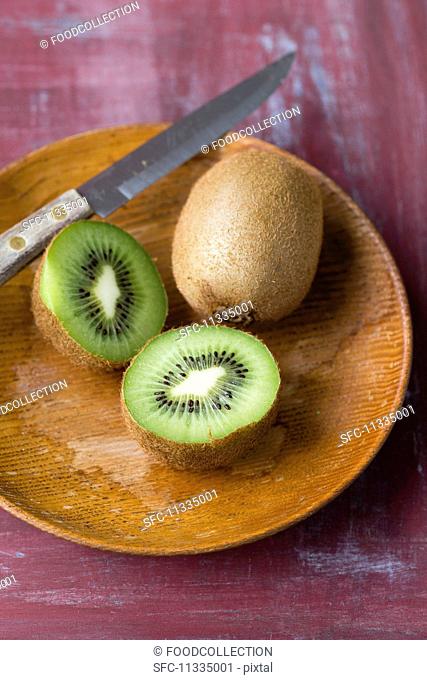 Kiwis on a wooden plate