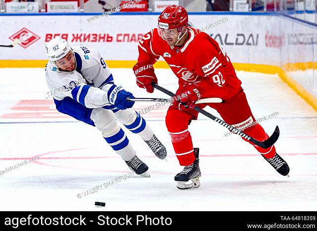RUSSIA, MOSCOW - NOVEMBER 14, 2023: Spartak's Shane Prince (R) and Dynamo's Igor Ozhiganov are in action in a 2023/24 KHL Regular Season ice hockey match...