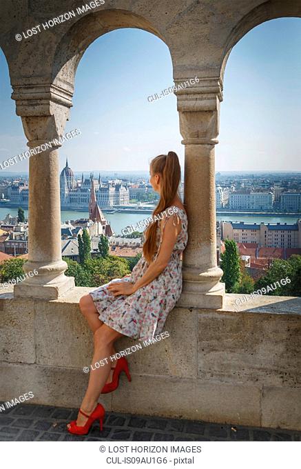Mid adult woman looking at view of Buda from the Fisherman's Bastion, Budapest, Hungary