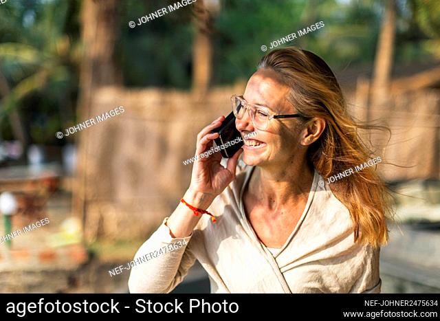 Woman in talking via cell phone