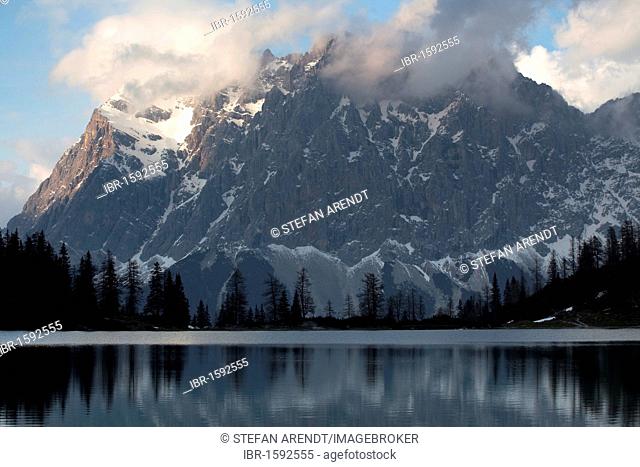 Lake Seebensee near Zugspitze Mountain in the evening light with reflections, Ehrwald, Austria, Europe