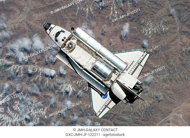 This view of the space shuttle Discovery was provided by an Expedition 23 crew member during a survey of the departing vehicle following undocking from the...