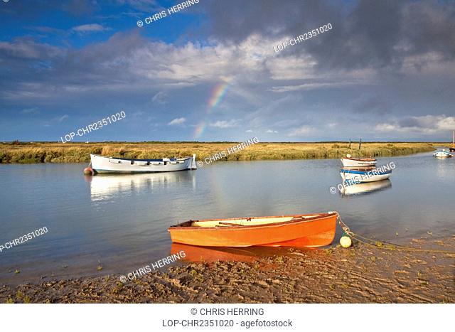 England, Norfolk, Morston. A rainbow over the small fishing harbour at Morston on the North Norfolk Coast
