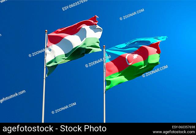 Beautiful national state flags of Hungary and Azerbaijan together at the sky background. 3D artwork concept