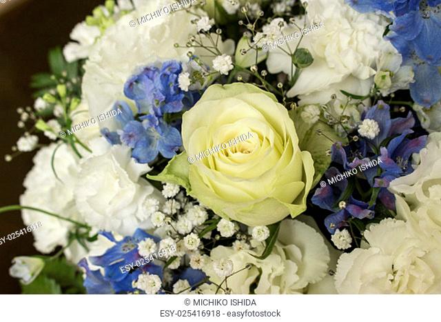 Roses, carnation, Texas bluebell & delphinium flower bouquet..