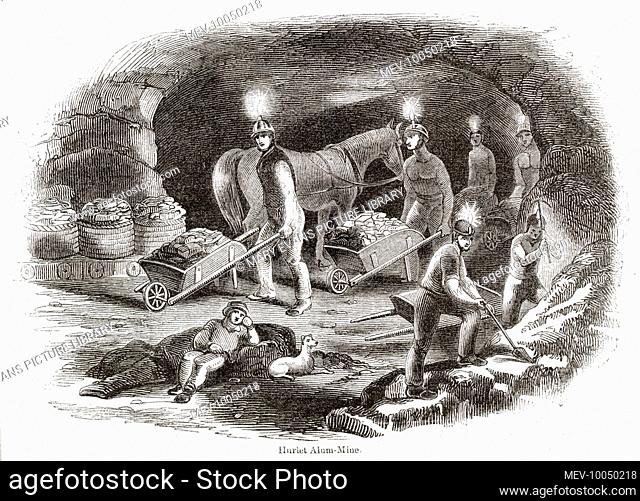 Interior of an underground alum mine at Hurlet near Glasgow. The miners, with candles attached to their helmets, dig into the rocks and cart away the mineral in...