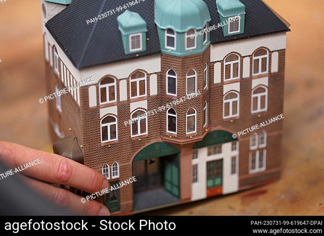 PRODUCTION - 18 July 2023, Hamburg: Model maker Tanja Schlabitz shows the new Speicherstadt moated castle in the Miniatur Wunderland workshop