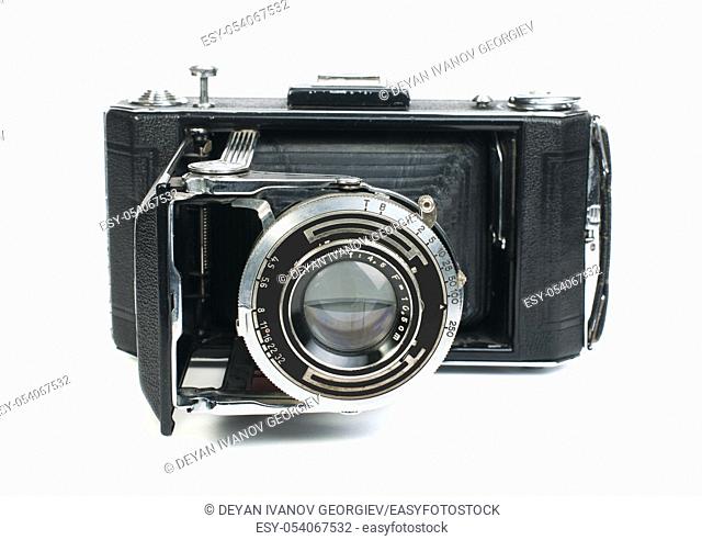 Old vintage camera with mech white isolated. Studio shot