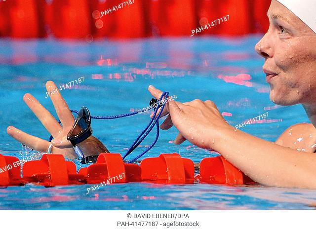 Britta Steffen of Germany looks on the scoreboard after the women's 100m Freestyle final during the 15th FINA Swimming World Championships at Palau Sant Jordi...