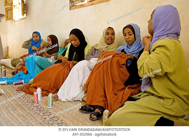 Girls embroidering tissues, particularly wedding veils, local tradition. Oasis of Siwa in the Libyan desert. Egypt