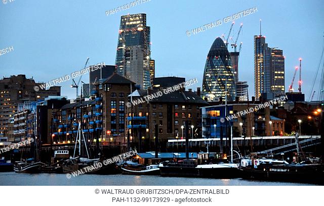 Ships cruise on ther River Thames with highrises and ""The Gerkin"" (2-R) marking the background in London,  England, 20 August 2017