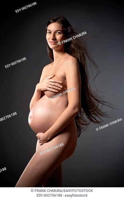 nude pregnant woman with very long brown hair