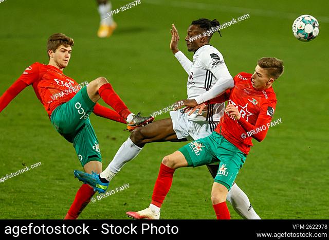 Oostende's Anton Tanghe, Eupen's Amara Baby and Oostende's Nick Batzner fight for the ball during a soccer match between KV Oostende and KAS Eupen