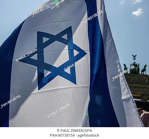 An Israeli flag waves on Pariser Platz in Berlin, Germany, 05 May 2016. The 'March of the Living' event for Holocaust Remembrance Day Yom HaShoah took place...