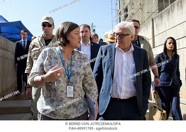 German Foreign Minister Frank-Walter Steinmeier (R) visits the UNHCR registration center with UNHCR representative in Lebanon Ninette Kelley in Ksara, Lebanon