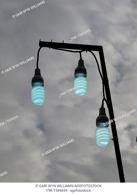 Three energy saving light bulbs outside