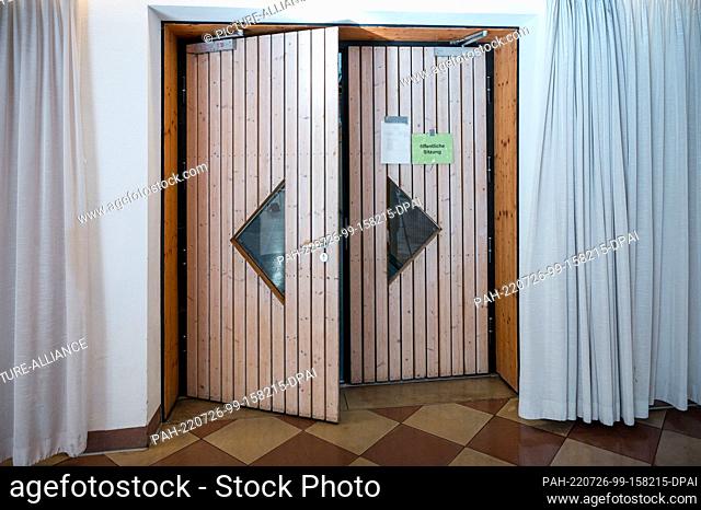26 July 2022, Bavaria, Estenfeld: The entrance door to the multipurpose hall of the White Mill Estenfeld. The trial in the safeguarding case against the...