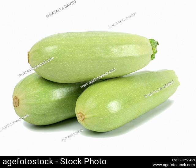 Three green zucchini isolated on white background, fresh vegetables