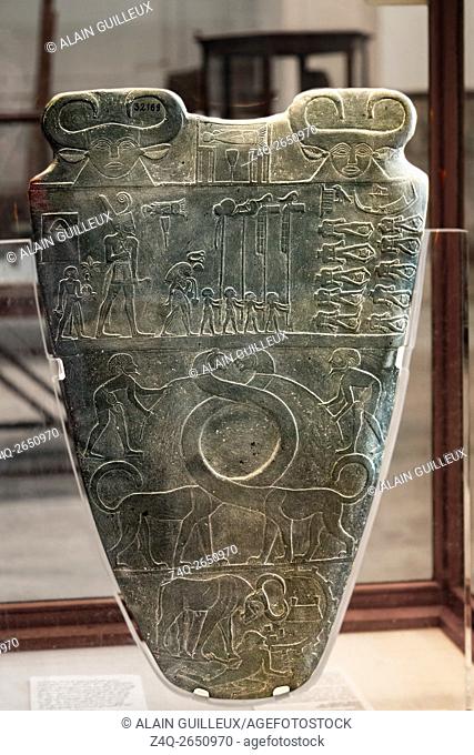 Egypt, Cairo, Egyptian Museum, the Narmer palette. Siltstone, found in Hierakonpolis. Procession of standards, fantastic animals and bull destroying an enemy...