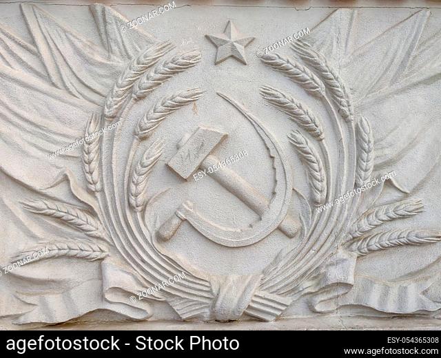 Bas-relief depicting the hammer and sickle of the USSR coat of arms