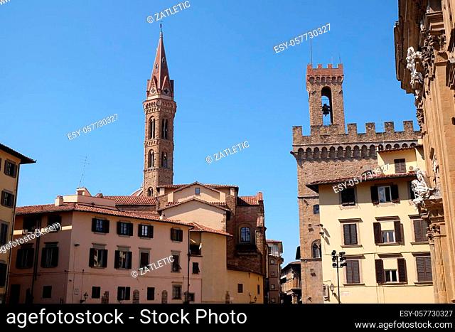 Bell tower of the Badia Fiorentina church and the Volognana Tower of the Palazzo del Bargello. View from the Piazza San Firenze at historic center of Florence