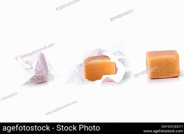 Sweet caramel candy on a white background