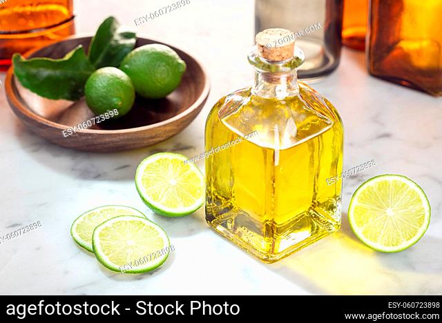 Lime essential oil. Lime oil for skin care, spa, wellness, massage, aromatherapy and natural medicine. Citrus oil